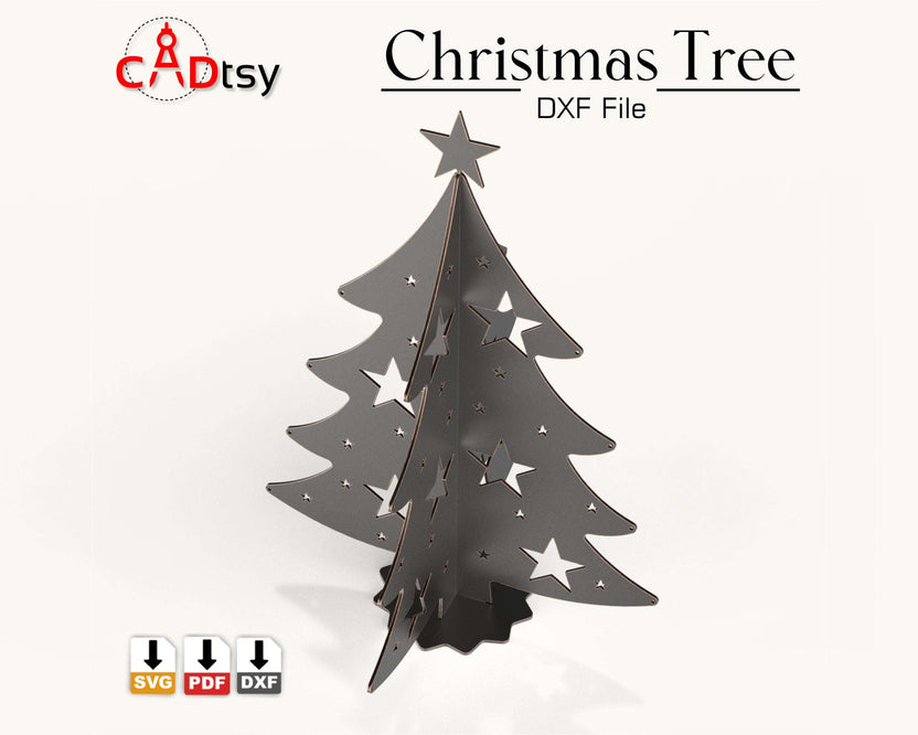 A 3D metal Christmas tree decoration, made from a DXF file, sitting on a table with festive lights in the background.
