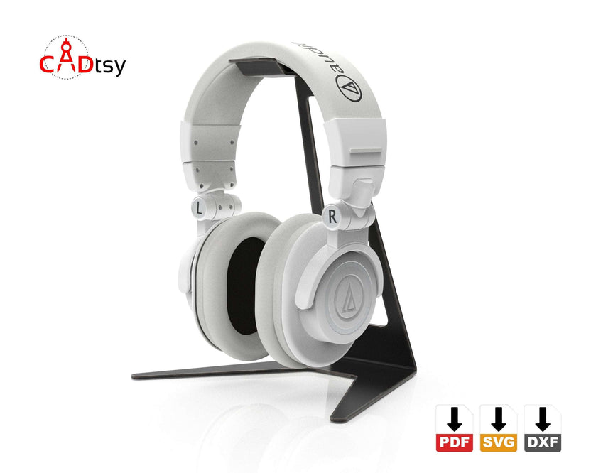 White headphones resting on black metal stand