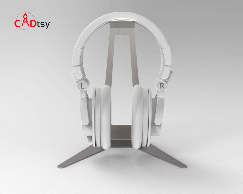 White headphones hanging on metal stand, straight front view
