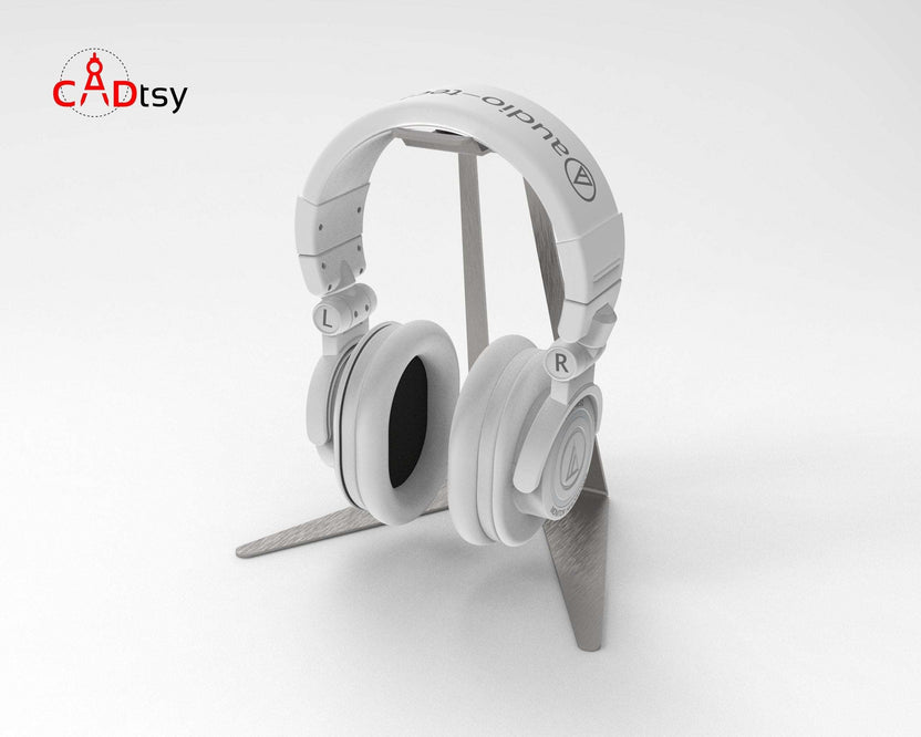 White headphones on gray metal stand, side angle