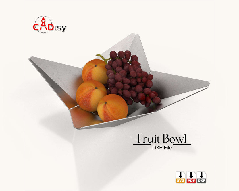 Silver origami fruit bowl with fruit, angled top view