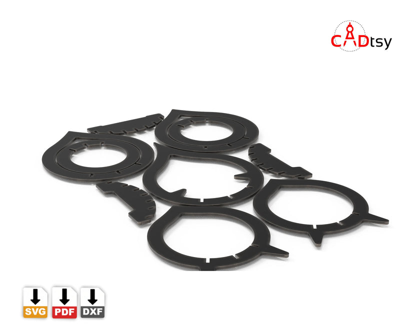 Flat black metal candle holder rings and flame parts before assembly